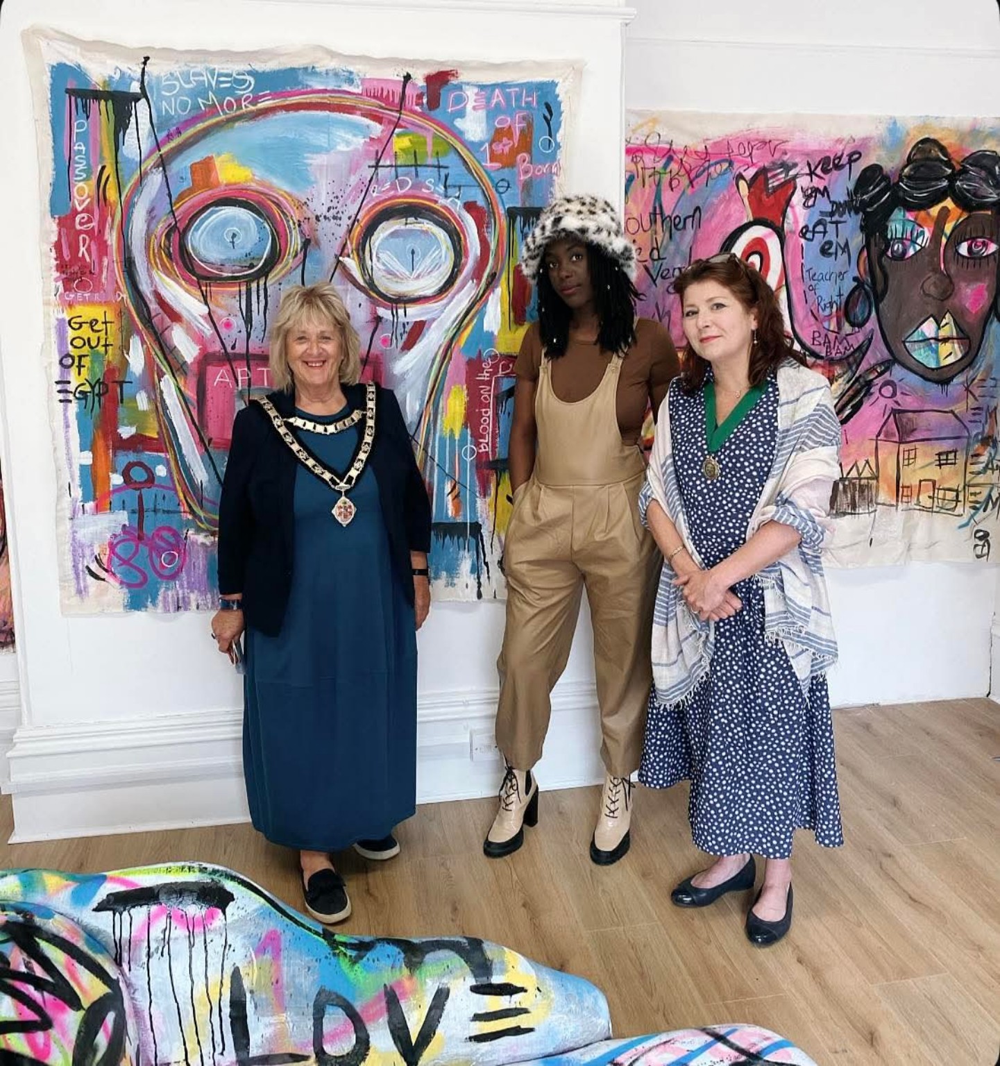An immersive ENNÈ installation with paintings, painted furniture and garments
