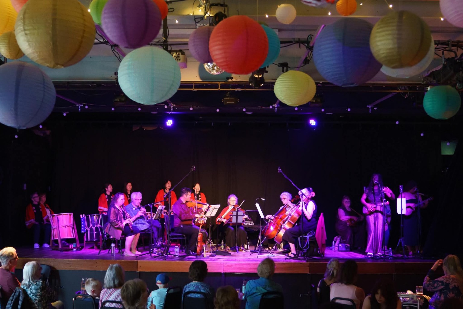 The Reimagined Orchestra performing on stage